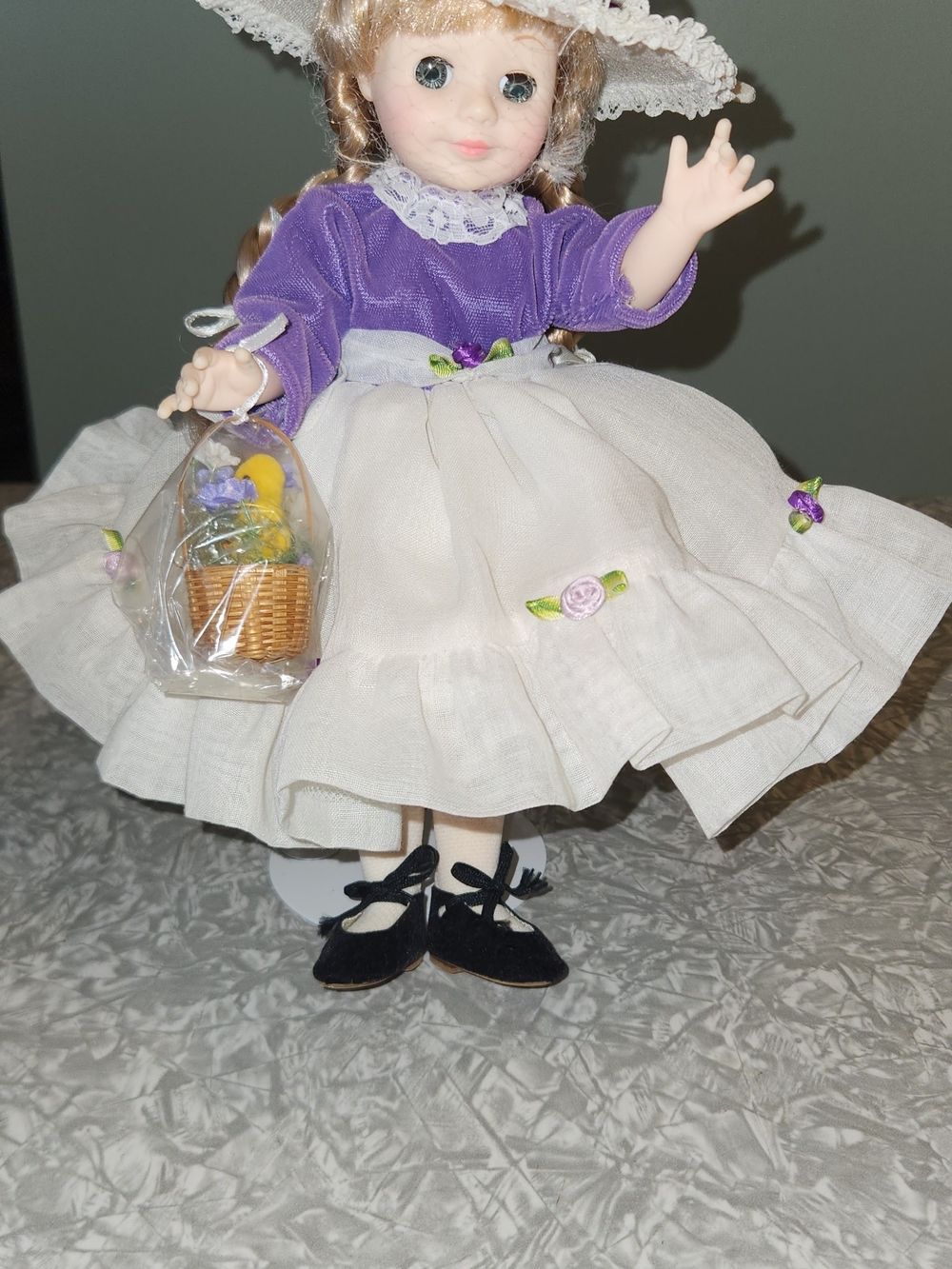 Collectible Porcelain-Style Doll in Purple and Cream Dress